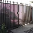 Straight Black Iron Gate With See Thru  Sheet Metal