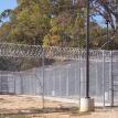 Galvanized Chain-Link Security Fence with Razor Wire.